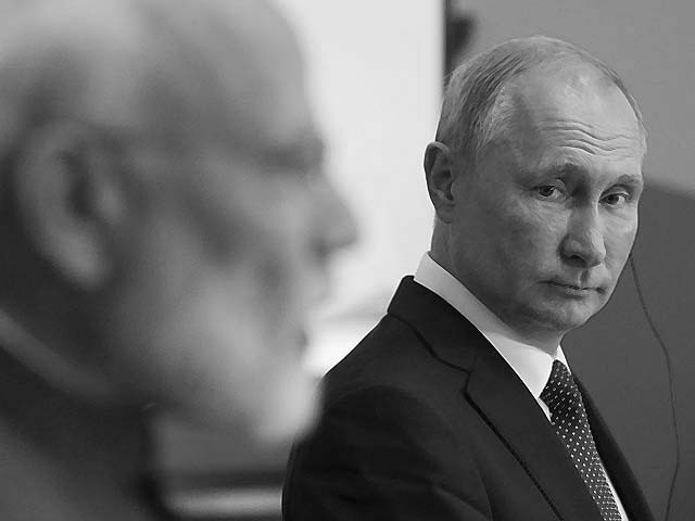 vladimir putin listens to narendra modi at the eastern economic forum photo afp vladimir putin listens to narendra modi at the eastern economic forum photo afp