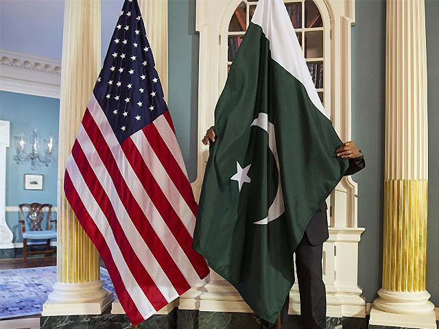 an employee adjusts a pakistani flag before a meeting of us and pakistani officials photo reuters an employee adjusts a pakistani flag before a meeting of us and pakistani officials photo reuters