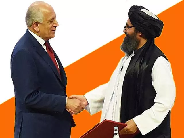 zalmay khalilzad and taliban co founder mullah abdul ghani baradar shake hands photo afp zalmay khalilzad and taliban co founder mullah abdul ghani baradar shake hands photo afp