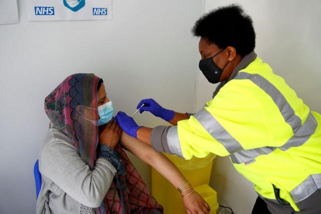 nasreen akhtar 35 receives a dose of pfizer vaccine against covid 19 at a vaccination centre in pharmacy 4 u amid the outbreak of the coronavirus disease covid 19 in blackburn britain may 19 2021 photo reuters nasreen akhtar 35 receives a dose of pfizer vaccine against covid 19 at a vaccination centre in pharmacy 4 u amid the outbreak of the coronavirus disease covid 19 in blackburn britain may 19 2021 photo reuters