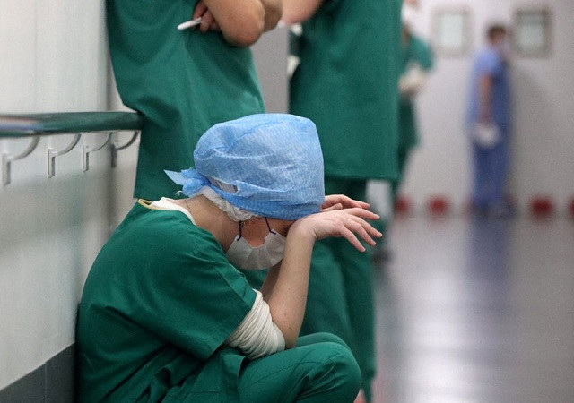 doctor ruxandra divan rests in the intensive care unit icu for covid 19 patients at hopitaux civils de colmar in colmar france december 15 2021 photo reuters