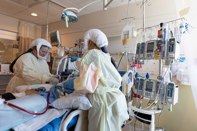 healthcare personnel work in a coronavirus disease covid 19 intensive care unit where they are dealing with a surge in cases of the delta variant at intermountain medical center in murray utah us in this handout photo provided july 23 2021 photo reuters