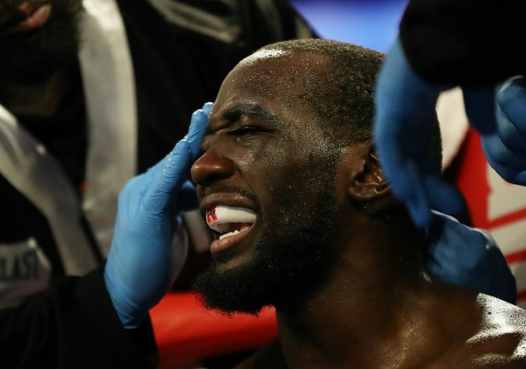 crawford crushes brook with fourth round tko