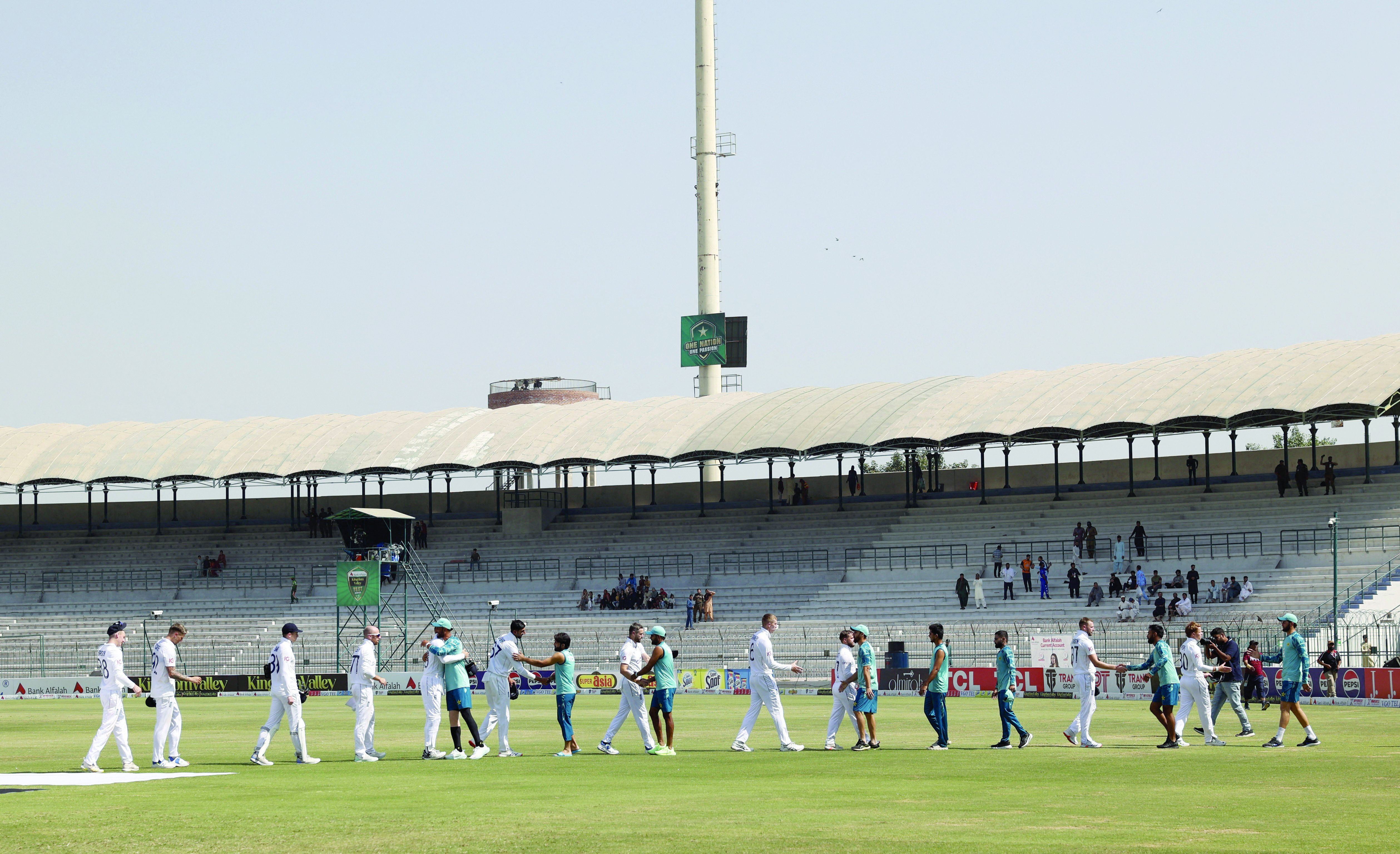 pakistan players shake hands with english player after their victory in first test match at the multan cricket stadium photo reuters