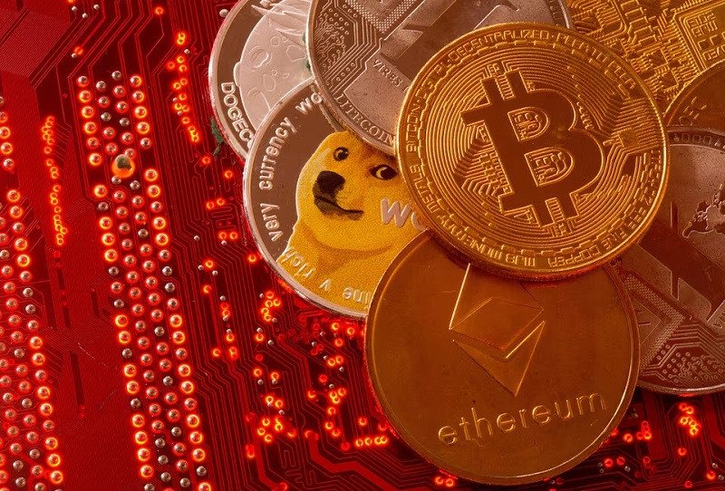 representations of cryptocurrencies bitcoin ethereum dogecoin ripple litecoin are placed on pc motherboard june 29 2021 photo reuters