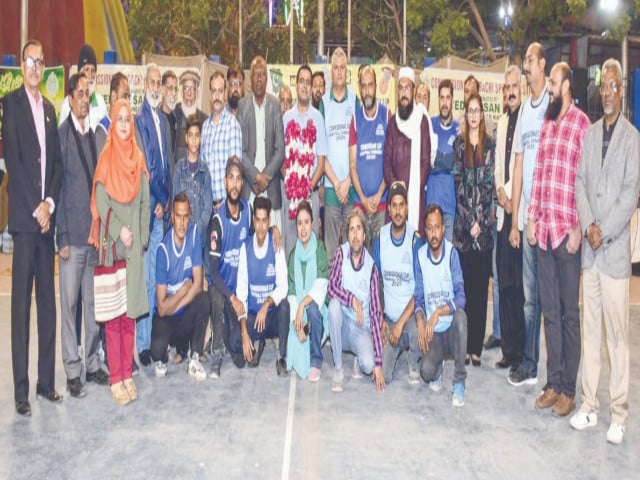 sjas players and organisers from kbba are seen with dc south javed nabi khoso at the opening of 8th commissioner karachi basketball tournament photo app