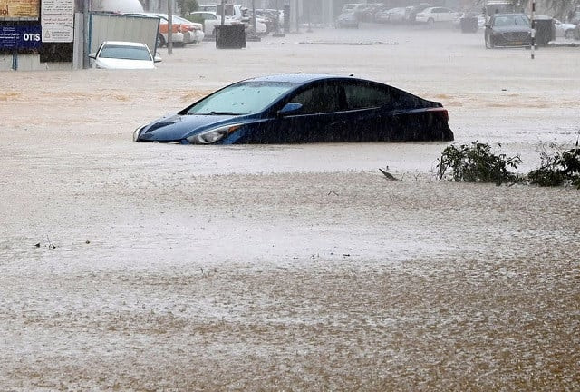 a car is partially submerged on a flooded street as cyclone shaheen makes landfall in muscat oman october 3 2021 photo reuters a car is partially submerged on a flooded street as cyclone shaheen makes landfall in muscat oman october 3 2021 photo reuters