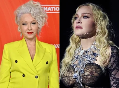cyndi lauper opens up about label s attempt to pit her against madonna that s not my style