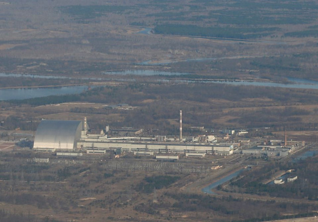 an aerial view from a plane shows a new safe confinement nsc structure over the old sarcophagus covering the damaged fourth reactor at the chernobyl nuclear power plant during a tour to the chernobyl exclusion zone ukraine april 3 2021 photo reuters an aerial view from a plane shows a new safe confinement nsc structure over the old sarcophagus covering the damaged fourth reactor at the chernobyl nuclear power plant during a tour to the chernobyl exclusion zone ukraine april 3 2021 photo reuters