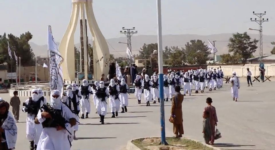taliban fighters march in uniforms on the street in qalat zabul province afghanistan in this still image taken from social media video uploaded august 19 2021 and obtained by reuters
