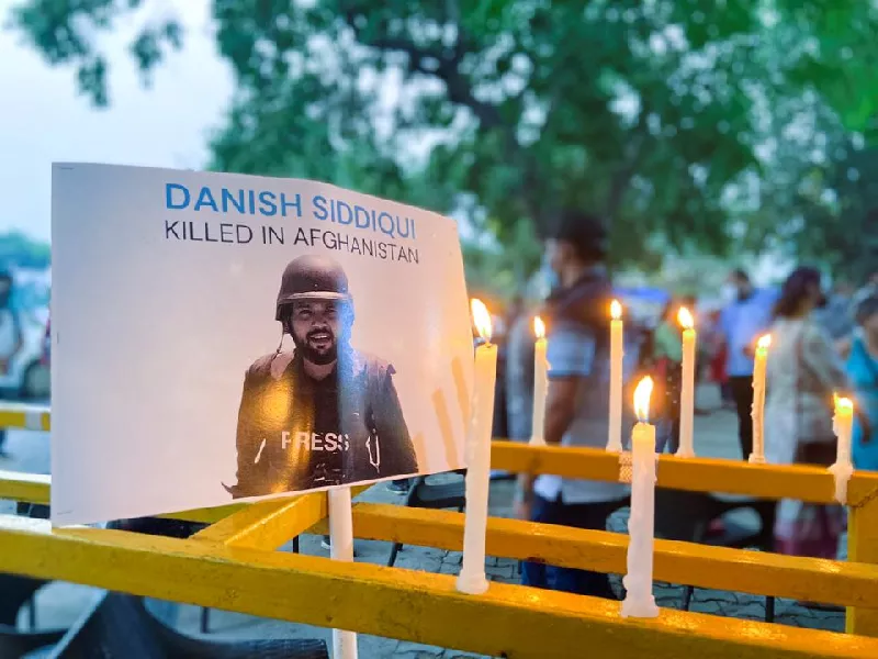 candles are seen lit next to a photograph of reuters journalist danish siddiqui outside the press club during a vigil in new delhi india july 17 2021 photo reuters candles are seen lit next to a photograph of reuters journalist danish siddiqui outside the press club during a vigil in new delhi india july 17 2021 photo reuters