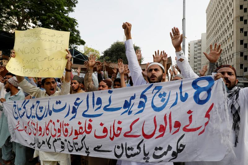 people chant slogans against women s right activists who organised demonstrations marking the international women s day during a protest in karachi pakistan march 12 2021 photo reuters