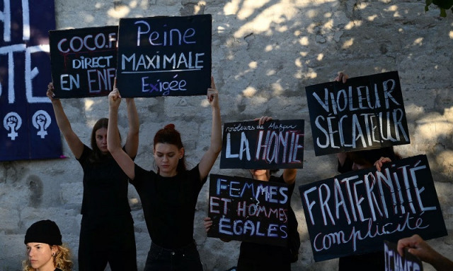 demonstrators hold placards during a during the trial of a man accused of drugging his wife and inviting strangers to rape her photo afp demonstrators hold placards during a during the trial of a man accused of drugging his wife and inviting strangers to rape her photo afp