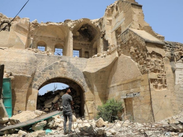 a palestinian man inspects barquq castle in the southern gaza strip city of khan younis on april 23 2024 photo xinhua