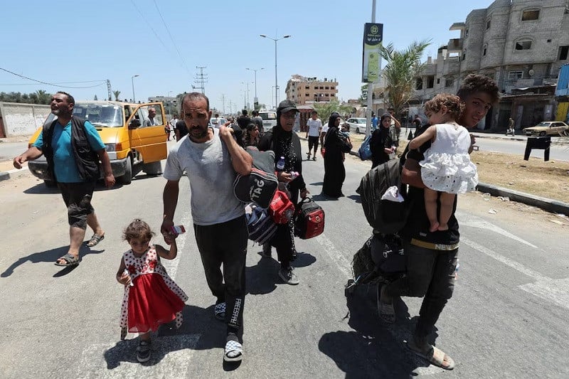 Displaced Palestinians, who fled north Gaza after they were ordered by Israeli army to move southward arrive in Nuseirat in the central Gaza Strip, July 11, 2024. PHOTO: REUTERS