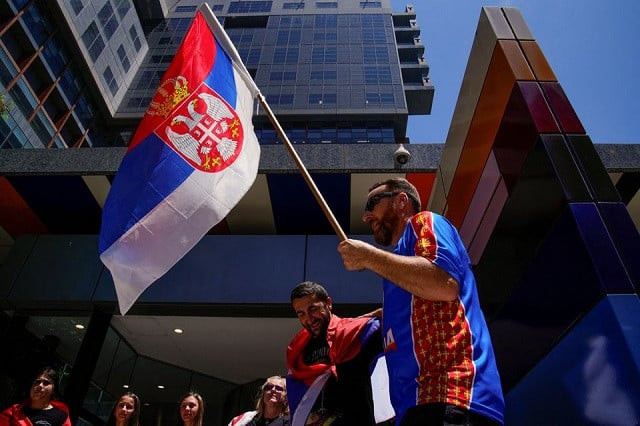 supporters of serbian tennis player novak djokovic rally outside the federal court of australia while the star athlete is in the midst of a legal battle over his visa to enter the country and play in the australian open in melbourne australia january 10 2022 photo reuters supporters of serbian tennis player novak djokovic rally outside the federal court of australia while the star athlete is in the midst of a legal battle over his visa to enter the country and play in the australian open in melbourne australia january 10 2022 photo reuters