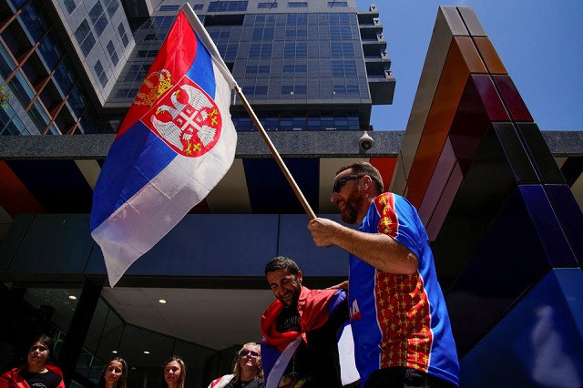 supporters of serbian tennis player novak djokovic rally outside the federal court of australia while the star athlete is in the midst of a legal battle over his visa to enter the country and play in the australian open in melbourne australia january 10 2022 photo reuters