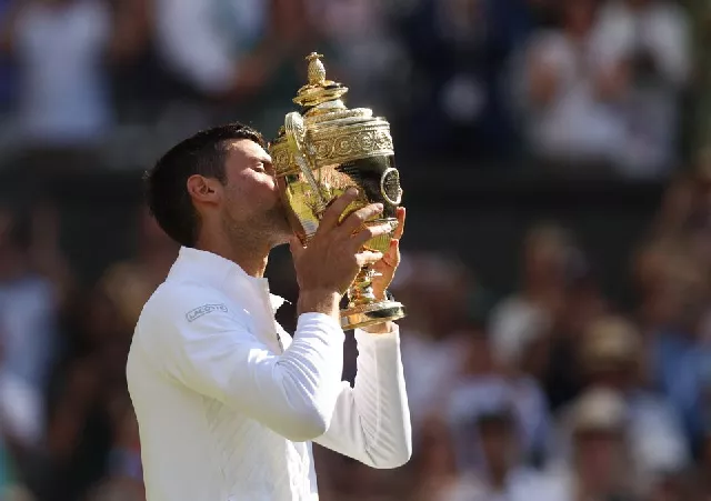 tennis wimbledon all england lawn tennis and croquet club london britain july 10 2022 serbia s novak djokovic celebrates with the trophy after winning the men s singles final against australia s nick kyrgios photo reuters tennis wimbledon all england lawn tennis and croquet club london britain july 10 2022 serbia s novak djokovic celebrates with the trophy after winning the men s singles final against australia s nick kyrgios photo reuters