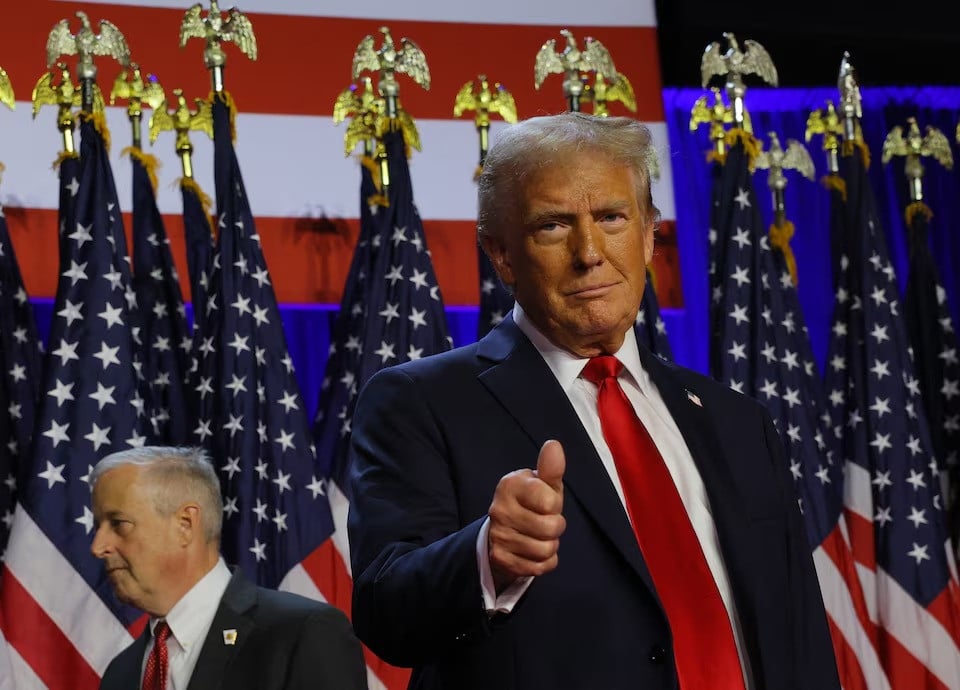 republican presidential nominee and former us president donald trump gestures as he stand on stage at his rally at the palm beach county convention centre in west palm beach florida on november 6 2024 file photo reuters