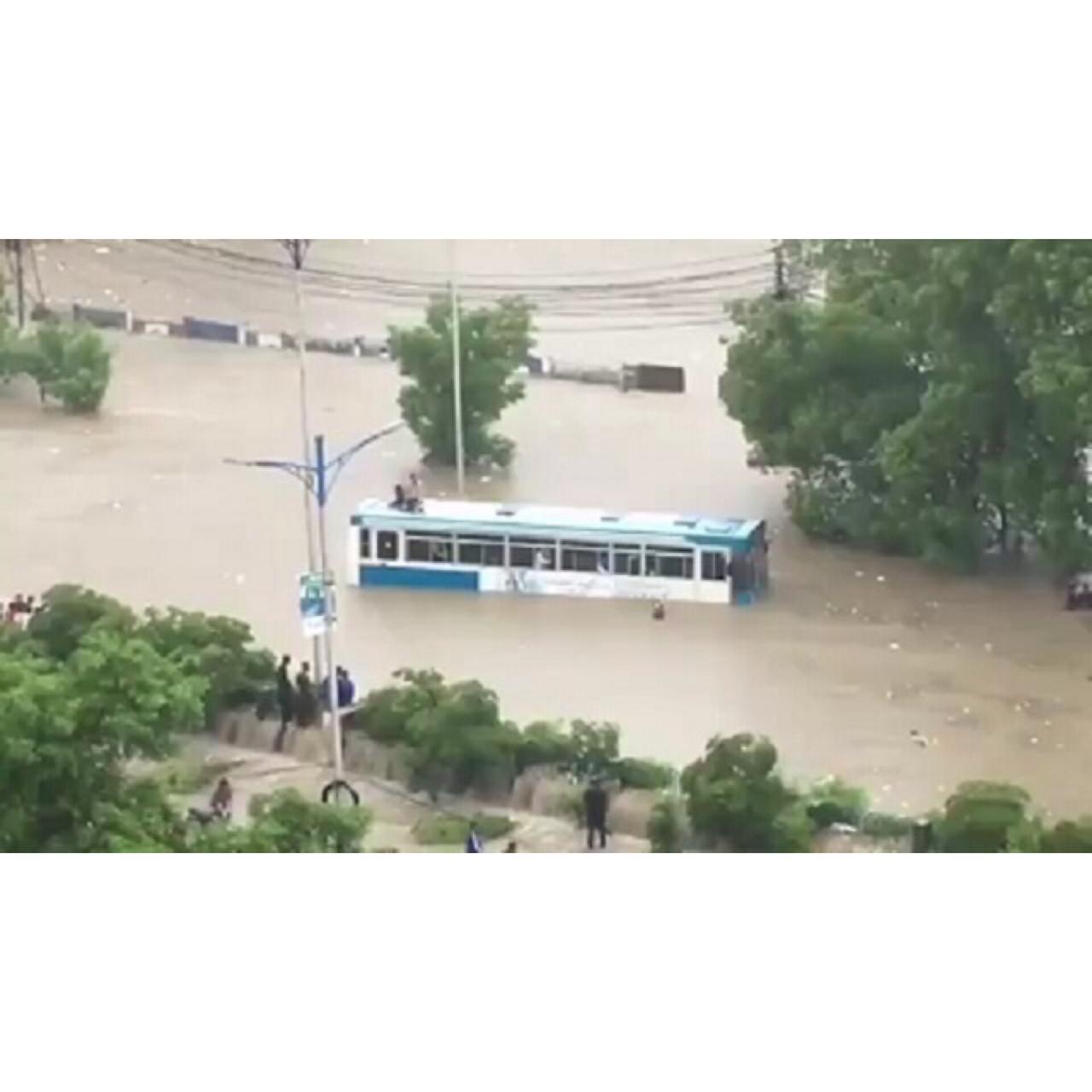 a bus carrying dow university staffers stuck in rainwater at nursery sharea faisal photo express file