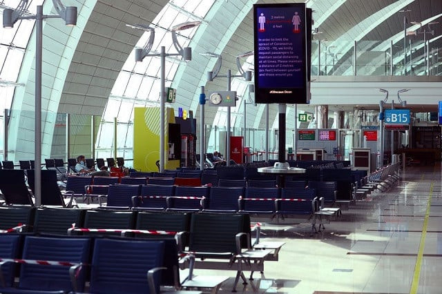 passengers wait before boarding at dubai international airport as emirates airline resumed limited outbound passenger flights amid outbreak of the coronavirus disease covid 19 in dubai uae april 27 2020 photo reuters