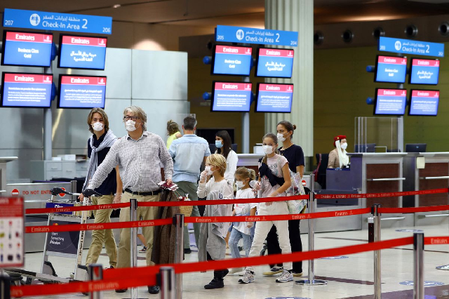 a family walks at dubai international airport as emirates airline resumed limited outbound passenger flights amid outbreak of the coronavirus disease covid 19 in dubai uae april 27 2020 photo reuters a family walks at dubai international airport as emirates airline resumed limited outbound passenger flights amid outbreak of the coronavirus disease covid 19 in dubai uae april 27 2020 photo reuters