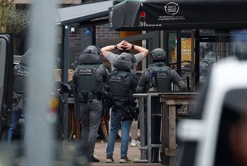 police officers detain a person near the cafe petticoat where several people were being held hostage in ede netherlands march 30 2024 photo reuters