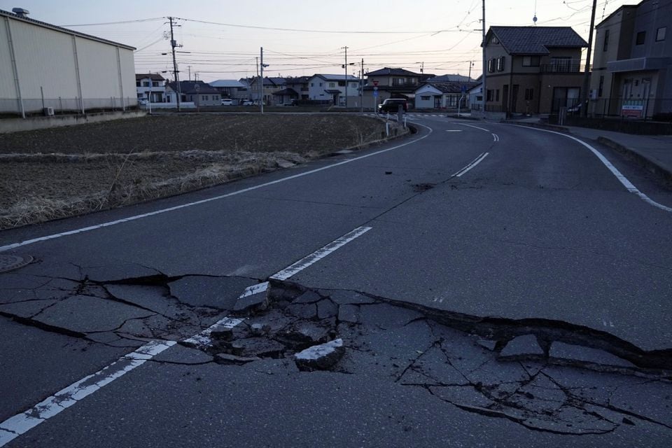 a broken road following a strong earthquake is pictured in soma fukushima prefecture japan in this photo taken by kyodo on march 17 2022 photo reuters