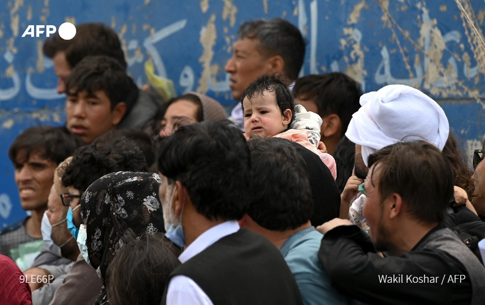 thousands of afghans including people who worked for the us mission in afghanistan have gathered near the airport in kabul hoping to flee the country after the taliban takeover afp