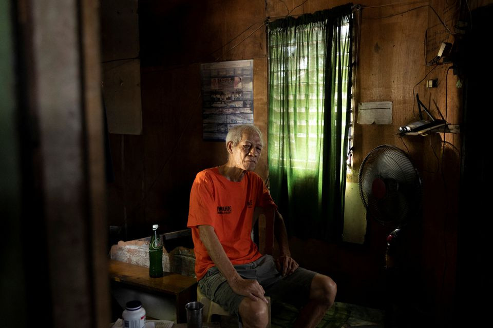 felix dalisay 70 who was detained and tortured during the late philippines dictator ferdinand marcos s brutal era of martial law is photographed in his home in quezon city metro manila philippines april 28 2022 picture taken april 28 2022 reuters eloisa lopez