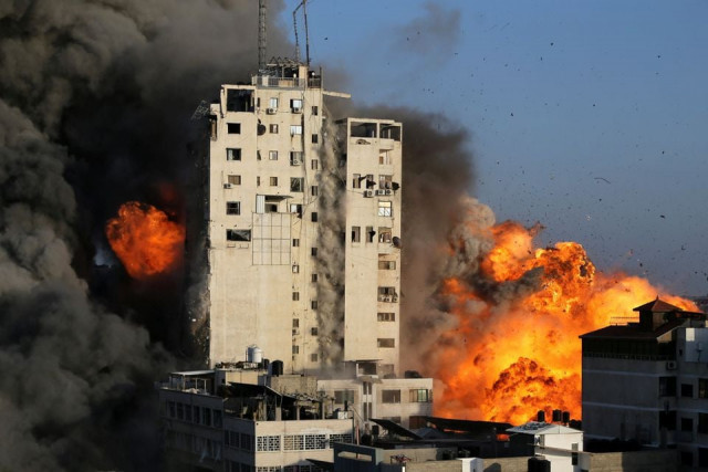 smoke and flames rise from a tower building as it is destroyed by israeli air strikes amid a flare up of israeli palestinian violence in gaza city photo reuters smoke and flames rise from a tower building as it is destroyed by israeli air strikes amid a flare up of israeli palestinian violence in gaza city photo reuters