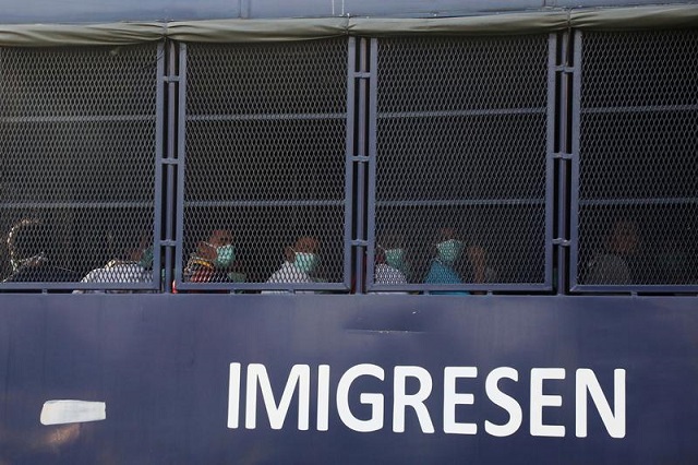 myanmar migrants to be deported from malaysia are seen inside an immigration truck in lumut malaysia february 23 2021 photo reuters