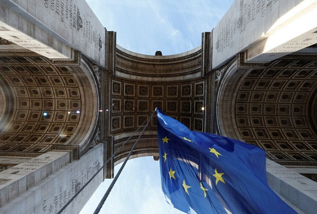 the european flag flies under the arc de triomphe to celebrate the start of the french presidency of the european union in paris france january 1 2022 photo reuters