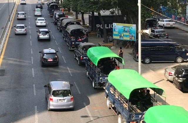 myanmar police vehicles drive near the city hall in yangon myanmar february 1 2021 photo reuters myanmar police vehicles drive near the city hall in yangon myanmar february 1 2021 photo reuters