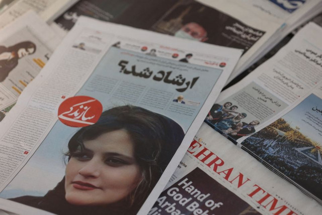a newspaper with a cover picture of mahsa amini a woman who died after being arrested by the islamic republic s morality police is seen in tehran iran september 18 2022 photo reuters file a newspaper with a cover picture of mahsa amini a woman who died after being arrested by the islamic republic s morality police is seen in tehran iran september 18 2022 photo reuters file
