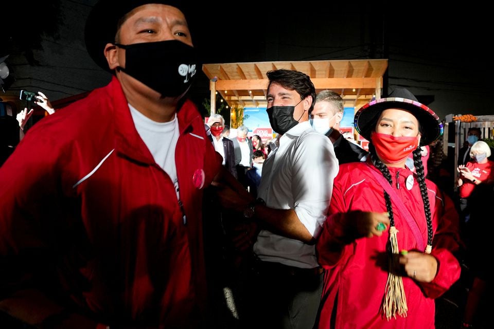 canada s liberal prime minister justin trudeau films a social media video with karmen omeasoo and lisa muswagon at an election campaign stop on the last campaign day before the election in winnipeg manitoba canada september 19 2021 reuters