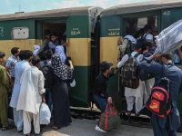 people board a train at the lahore railway station as they return home ahead of eidul azha photo nni