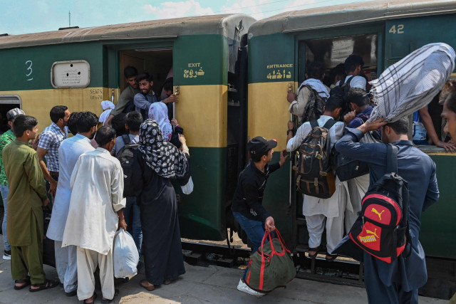 people board a train at the lahore railway station as they return home ahead of eidul azha photo nni people board a train at the lahore railway station as they return home ahead of eidul azha photo nni
