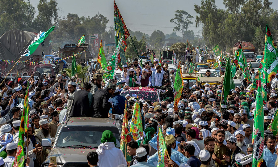 Devotees take part in Eid Miladun Nabi procession in Peshawar on October 19. PHOTO: AFP