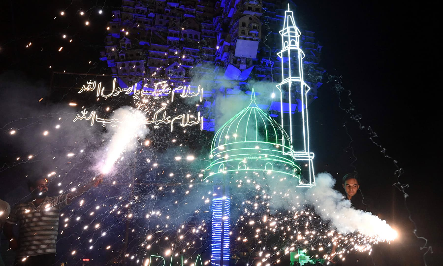 Youth play with fireworks during the celebrations for Eid Miladun Nabi in Lahore on October 18. PHOTO: AFP