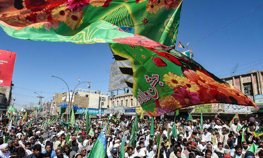 Devotees chant slogans and take part in a religious procession to celebrate Eid Miladun Nabi in Quetta on October 19. PHOTO: AFP