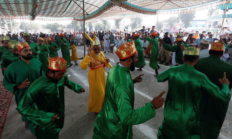 People perform dhamaal during the celebrations to mark Eid Miladun Nabi in Karachi, October 19. PHOTO: REUTERS