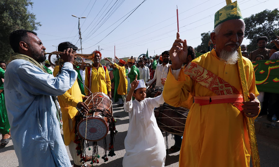 A boy performs dhamaal with others during the celebrations to mark Eid Miladun Nabi in Karachi, October 19. PHOTO: REUTERS