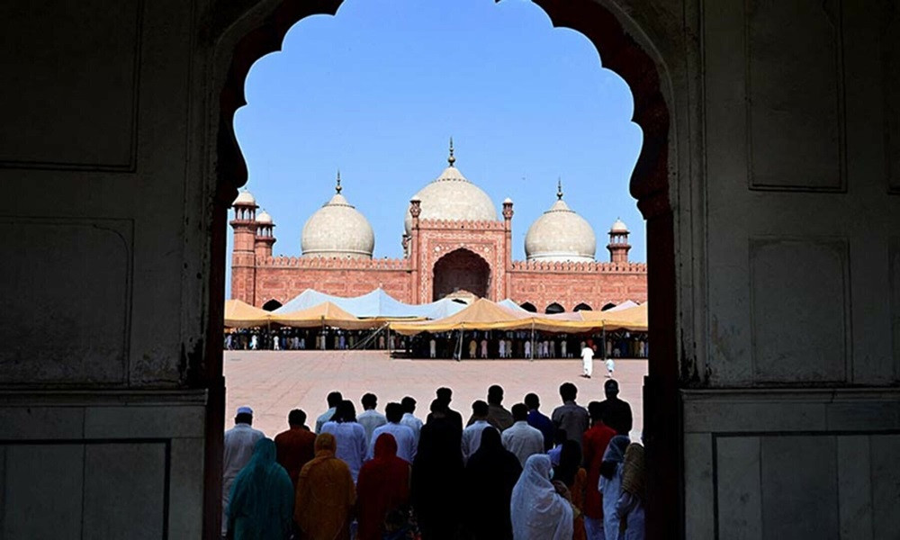 Muslim devotees offer Eidul Azha prayers at Lahore’s Badshahi mosque on June 17. PHOTO: AFP