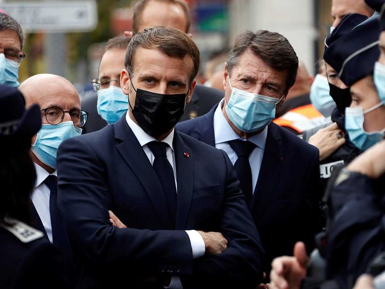 french president emmanuel macron and nice mayor christian estrosi right meet police officers after a knife attack at notre dame church in nice southern france thursday oct 29 2020 image credit ap