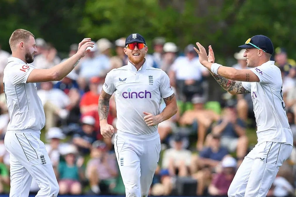 england s gus atkinson brydon carse and ben stokes celebrate the wicket of new zealand s kane williamson during the first day of the first test cricket match between new zealand and england at hagley oval in christchurch on november 28 2024 photo afp