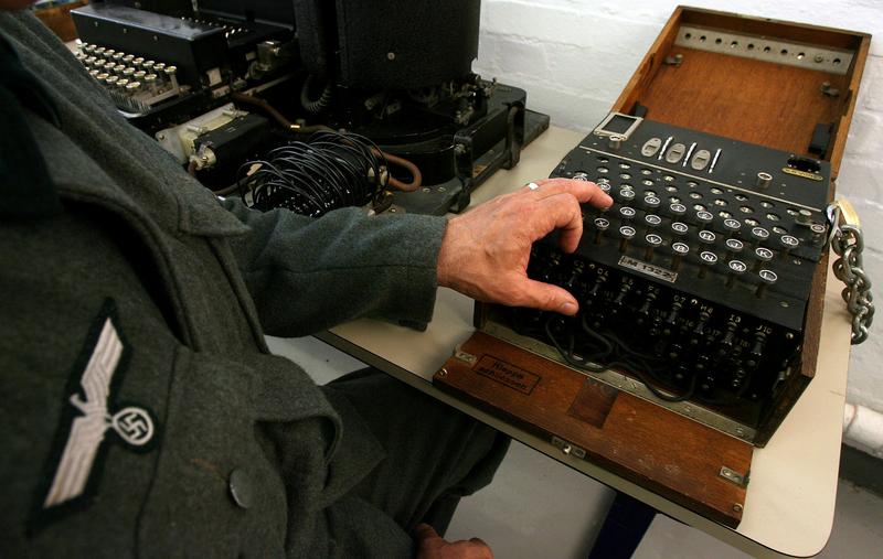 an actor dressed as a german soldier shows the use of the enigma machine in bletchley park museum in bletchley central england september 6 2006 photo reuters file