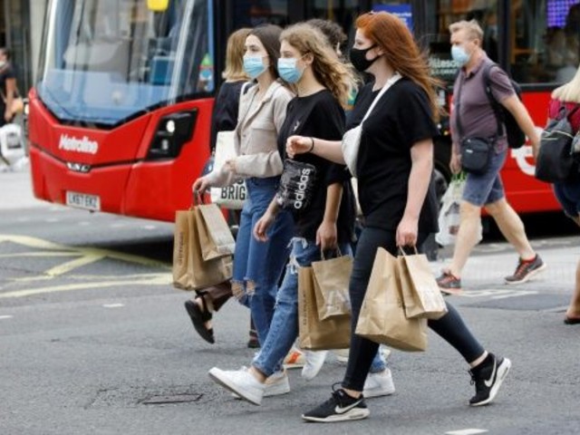 shoppers wear face masks on oxford street in london after face coverings became mandatory in shops and supermarkets in britain photo afp