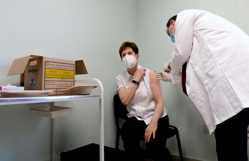 healthcare worker adrienne kertesz receives the first injection nationwide with a dose of pfizer biontech covid 19 vaccine at the del pest central hospital as the coronavirus disease covid 19 outbreak continues in budapest hungary december 26 2020 photo reuters