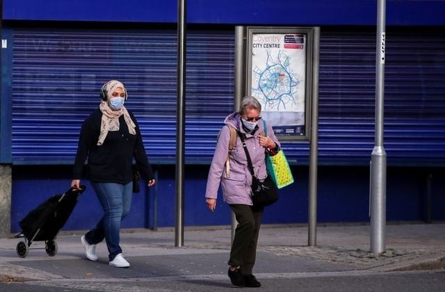people wearing protective masks are seen amid the outbreak of the coronavirus disease covid 19 in coventry britain october 25 2020 photo reuters people wearing protective masks are seen amid the outbreak of the coronavirus disease covid 19 in coventry britain october 25 2020 photo reuters